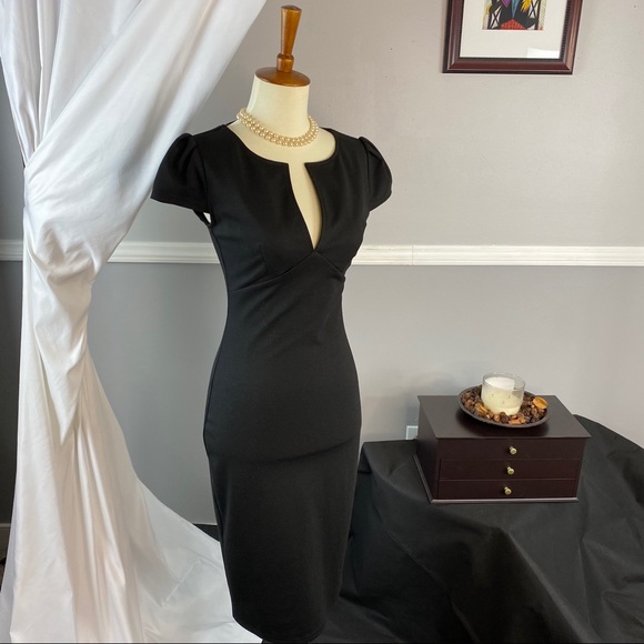 Dresses & Skirts - Boutique Black fitted dress with deep v neckline